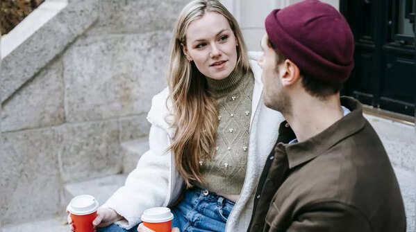 Two people sitting apart, emphasizing the need for personal space