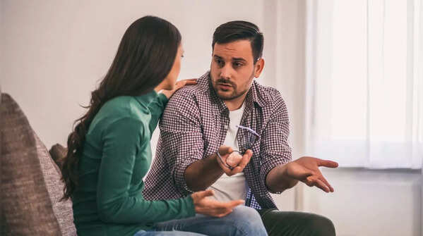 A couple enjoying time together, but one partner seems distant